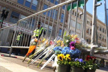 Flowers are left at a security gate near the scene of the bombing attack at the Boston Marathon, April 16, 2013. (Spencer Platt/Getty)