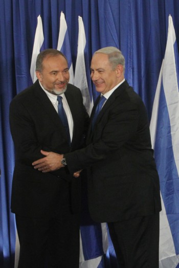 Israeli Prime Minister Benjamin Netanyahu, right, of Likud and Foreign Minister Avigdor Liberman of Yisrael Beiteinu holding a joint news conference announcing that their two parties are joining forces ahead of the upcoming Israeli general elections, Oct. 25, 2012.  (Miriam Alster/Flash90)