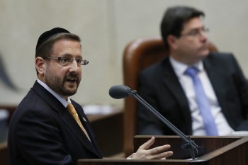 Dov Lipman, an American-born haredi Orthodox Knesset member for the centrist Yesh Atid party, speaking on the Knesset floor, March 2013. (Miriam Alster/Flash90)