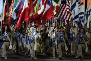 Flag-bearing participants at the opening ceremonies of the18th Maccabiah Games show off the countries they represent as they march into Ramat Gan Stadium on July 13, 2009. (Uri Lenz / Flash90 / JTA)