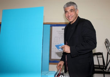 Yair Lapid, head of the Yesh Atid party, casting his vote in Tel Aviv during the general elections for Israel's 19th parliament, Jan. 22, 2013. (Gideon Markowicz/Flash90)