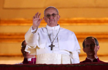 Newly elected Pope Francis I waving to the crowds on the central balcony of St. Peter's Basilica in Vatican City, March 13, 2013. (Peter Macdiarmid/Getty)