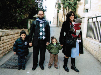 Rabbi Jonathan Sandler and his two sons, Arieh, left, and Gabriel, were killed in the shooting at the Ozar Hatorah School in Toulouse, France. The rabbi's wife is holding their daughter. (Flash90/JTA) (Flash90)