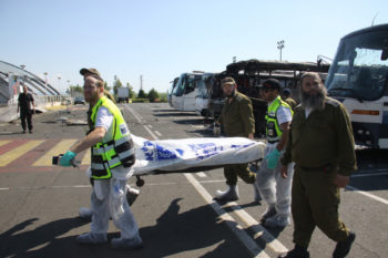 Israeli ZAKA emergency rescue team carrying a body bag with one of the victims of the terrorist attack in Burgas, Bulgaria, July 19, 2012.  (Dano Monkotovic/FLASH90)