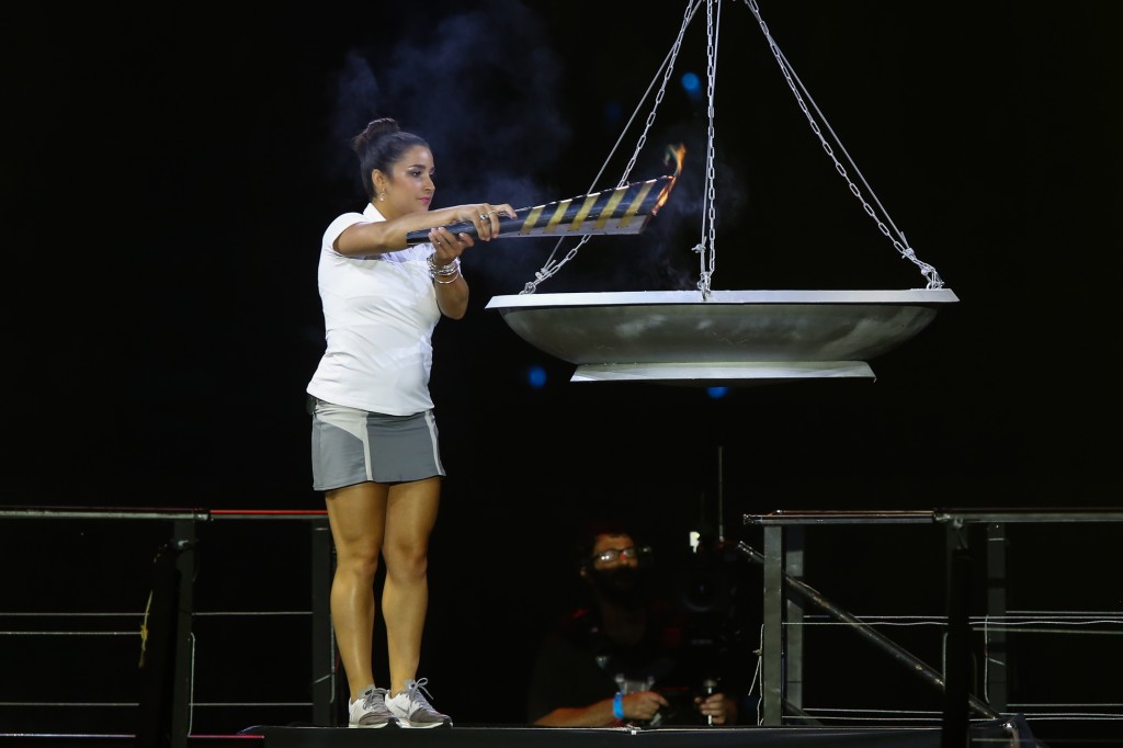 U.S. Olympic gymnast and gold medalist Aly Raisman lighting the torch during the opening ceremony of the 19th Maccabiah Games at Jerusalem's Teddy Stadium, July 19, 2013. (Yonatan Sindel/Flash90/JTA)