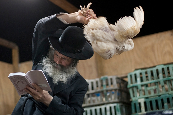 A haredi Orthodox man participates in the kapparot ritual in the Israeli city of Ashdod. (Dima Vazinovich/Flash90) 