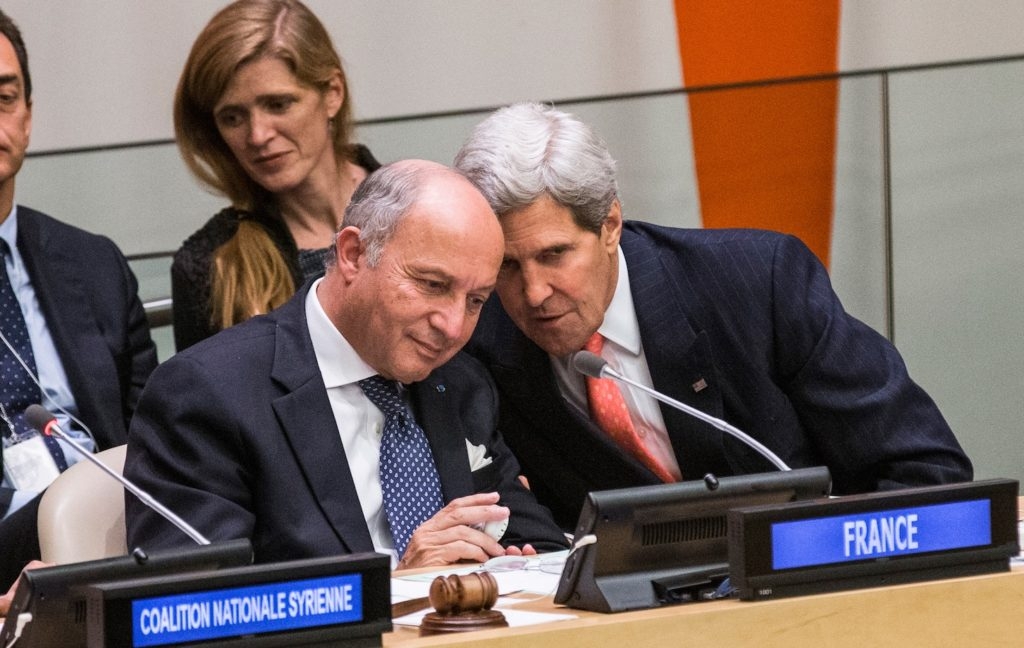 French Foreign Minister Laurent Fabius, left, conferring with U.S. Secretary of State John Kerry on the sidelines of the 68th United Nations General Assembly, Sept. 26, 2013. (Andrew Burton/Getty Images)