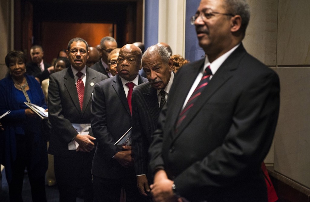 Rep. John Lewis (D-Ga.), second from right, with other members of the Congressional Black Caucus before a ceremony at the U.S. Capitol, Jan. 6, 2015. (Gabriella Demczuk/Getty Images)