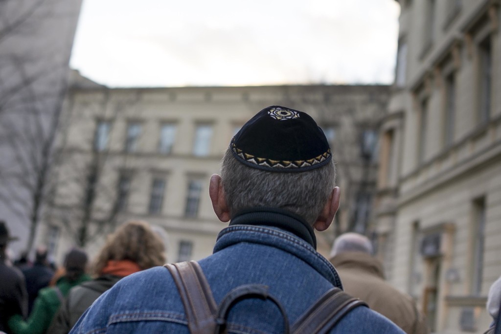 A man wears a kippah as he takes part in a silent march to commemorate the 75th anniversary of the Kristallnacht pogroms, Nov. 9, 2013 in Berlin. (Carsten Koall/Getty Images)