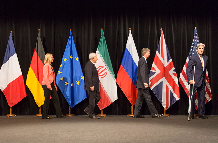 EU High Representative for Foreign Affairs and Security Policy Federica Mogherini, Foreign Minister of Iran, Mohammad Javad Zarif, British Foreign Secretary of State for Foreign and Commonwealth Affairs, Philip Hammond, and US Secretary of State John Kerry pose for a photo after last Working Session of E 3+3 negotiations on July 14, 2015 in Vienna, Austria. Six world powers; US, UK, France, China, Russia and Germany have reached a deal with Iran on limiting Iranian nuclear activity. (Thomas Imo/Photothek/Getty Images)