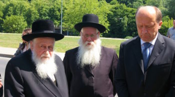 Rabbi Shaye Schlesinger (left), chairman of the Committee for the Preservation the Jewish Cemeteries in Europe, with former Lithuanian prime minister Andrius Kubilius (right) at a ceremony in Vilnius in June 2011. (Courtesy of the Committee for the Preservation the Jewish Cemeteries in Europe.)