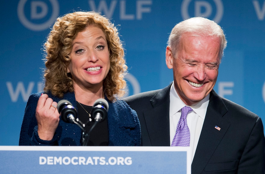 Vice President Joe Biden, right, laughing as he is introduced by DNC Chair Rep. Debbie Wasserman Schultz, D-Fla., at the DNC Women's Leadership conference in Washington, Sept. 19, 2014. (Manuel Balce Ceneta/AP Images)