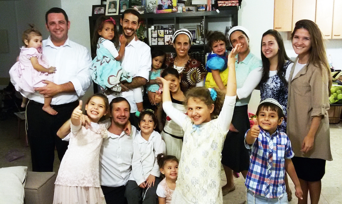 Brazilian immigrant Fabio Erlich, far left, with his family and other Brazilian emigres in the Israeli city of Modiin. (Courtesy of Erlich family)