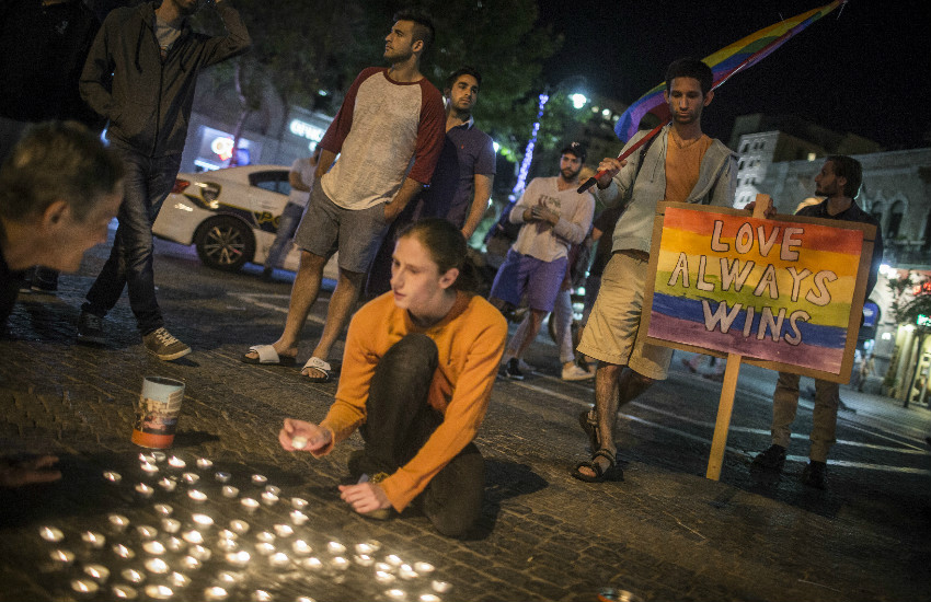 Young Israeli LGBT equality activists light candles at Zion Square in Jerusalem in solidarity with the victims of the shooting attack at Pulse,a gay night club in Orlando, Florida, on June 12, 2016, by an American of Afghan descent who claimed allegiance to ISIS. (Photo by Hadas Parush/Flash90)