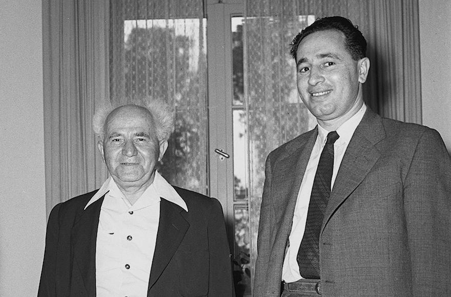 Shimon Peres, right, then Directer General of the Defense Ministry, with then Defense Minister David Ben Gurion in 1955. (GPO/Flash90)