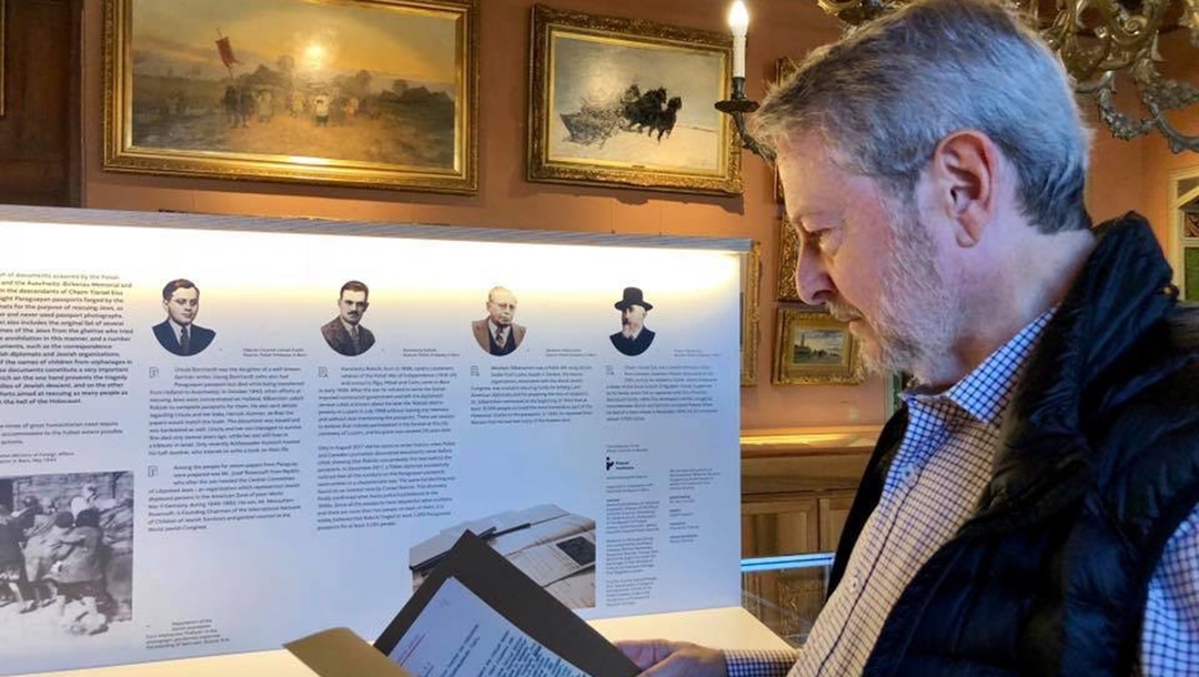 Jeffrey cymbler examining documents tied to the Bernese Group in Switzerland in 2017. Courtesy of Jeffrey Cymbler