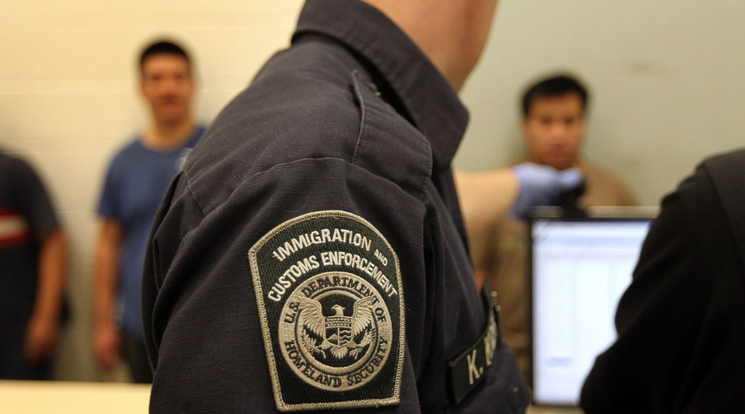 Undocumented Mexican immigrants are photographed while being in-processed at the Immigration and Customs Enforcement (ICE), center in Phoenix, Arizona, April 28, 2010. (John Moore/Getty Images)