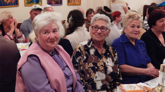 Elderly Jews attending the Rosh Hashanah dinner at Hesed Triaspol, Transnistria in 2018. (Courtesy of JDC)