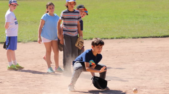 Kids play baseball at Camp Ramah in California. The camp will face a significan shortfall if it needs to refund all of its tuition this year. (Courtesy of Ramah in California)