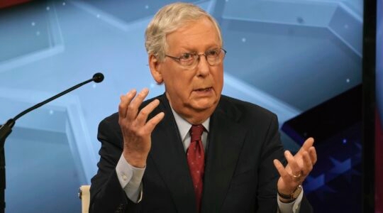 Senate Majority Leader Mitch McConnell (R-KY) speaks with Democratic challenger Amy McGrath during a debate in Lexington, Kentucky on October 12, 2020. (Michael Clubb-Pool/Getty Images)