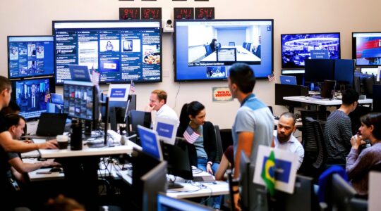 Employees work in a Facebook unit focused on the fight against misinformation and manipulation in Menlo Park, California in 2018. (Noah Berger/AFP via Getty Images)