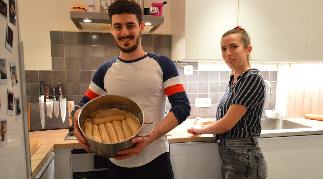 Gal Garber and Mathilde Lair preparing jachnun in their apartment in Amsterdam, the Netherlands on Nov. 20, 2020. (Mathilde Lair)