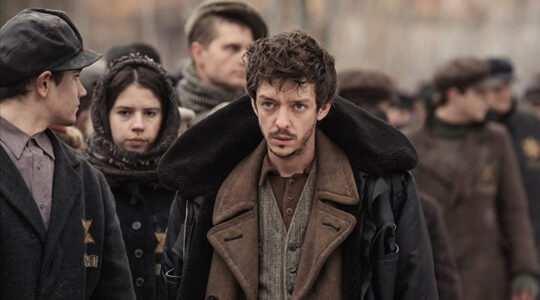 Actor Nahuel Perez Biscayart portrays a Jewish inmate at a concentration camp during filming in Belarus of the film 'Persian Lessons' in 2019. (Courtesy of HyperFilms)