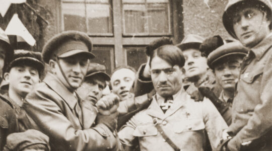 Holocaust survivors enact a Purim play featuring an Adolf Hitler character at a camp for displaced persons in Landsberg, Germany on April 15, 1946. (Herbert Friedman/United States Holocaust Memorial Museum)