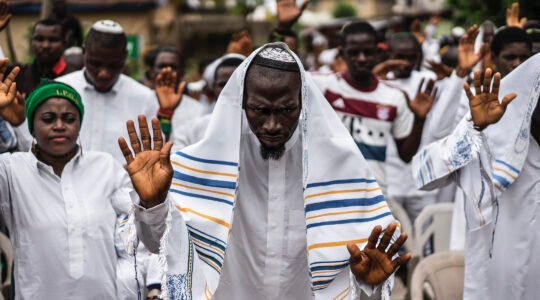 Nigerian worshippers celebrate Shabbat in 2017. The country's small Jewish community has become caught up in a separatist movement led by a Jewish activist. (Marco Longari/AFP via Getty Images)