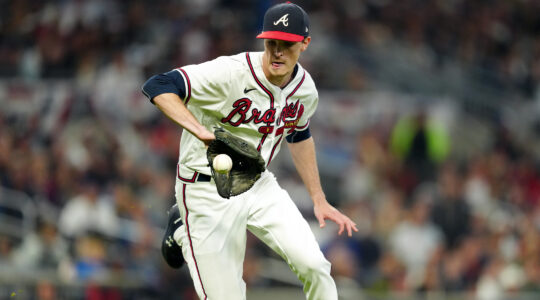 Max Fried fields the ball