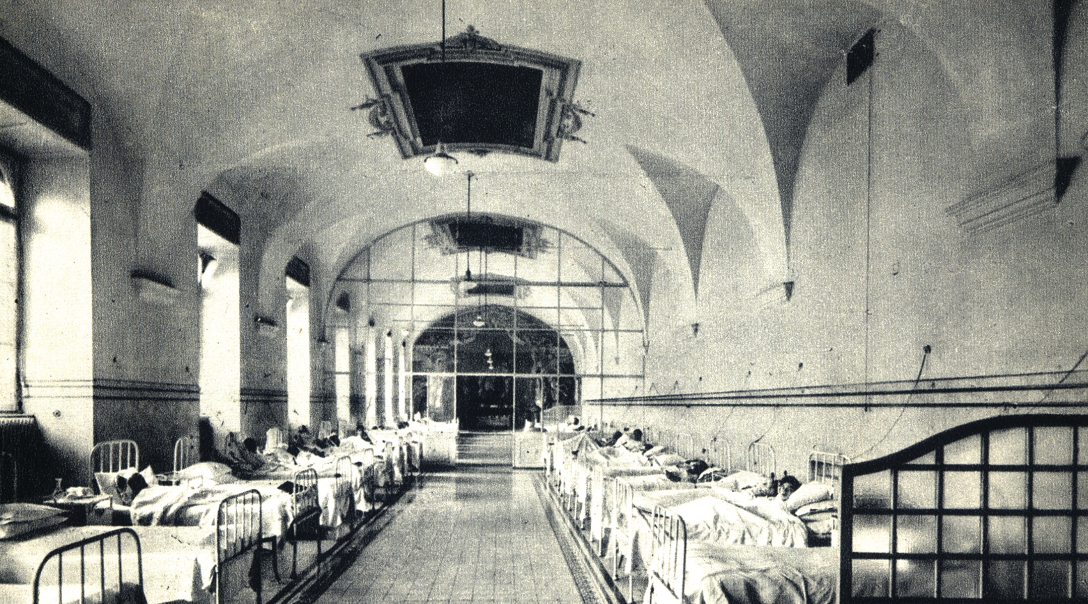 Patients laying in beds.