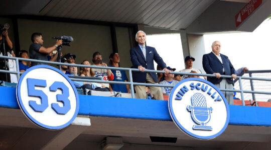 Sandy Koufax in front of Vin Scully's plaque