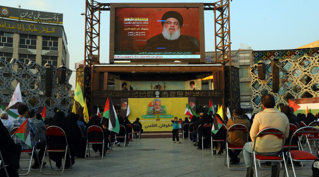 People listen to a speech by Hezbollah leader Hassan Nasrallah on November 3, 2023 in Tehran, Iran. (Majid Saeedi/Getty Images)