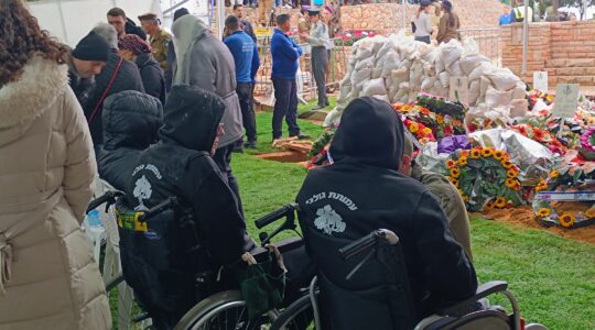 Wounded Israeli soldiers were amonth the thousands who attended the funeral on Dec. 13 of Tomer Grinberg, an Israeli officer killed the previous day, Israel's bloodiest day since Oct. 7. (Eliyahu Freedman)