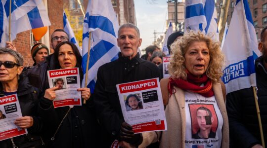 Left wing Israeli leader Yair Golan alongside protesters outside the home of U.N. Secretary-General Antonio Guterres, December 8, 2024. (Luke Tress)