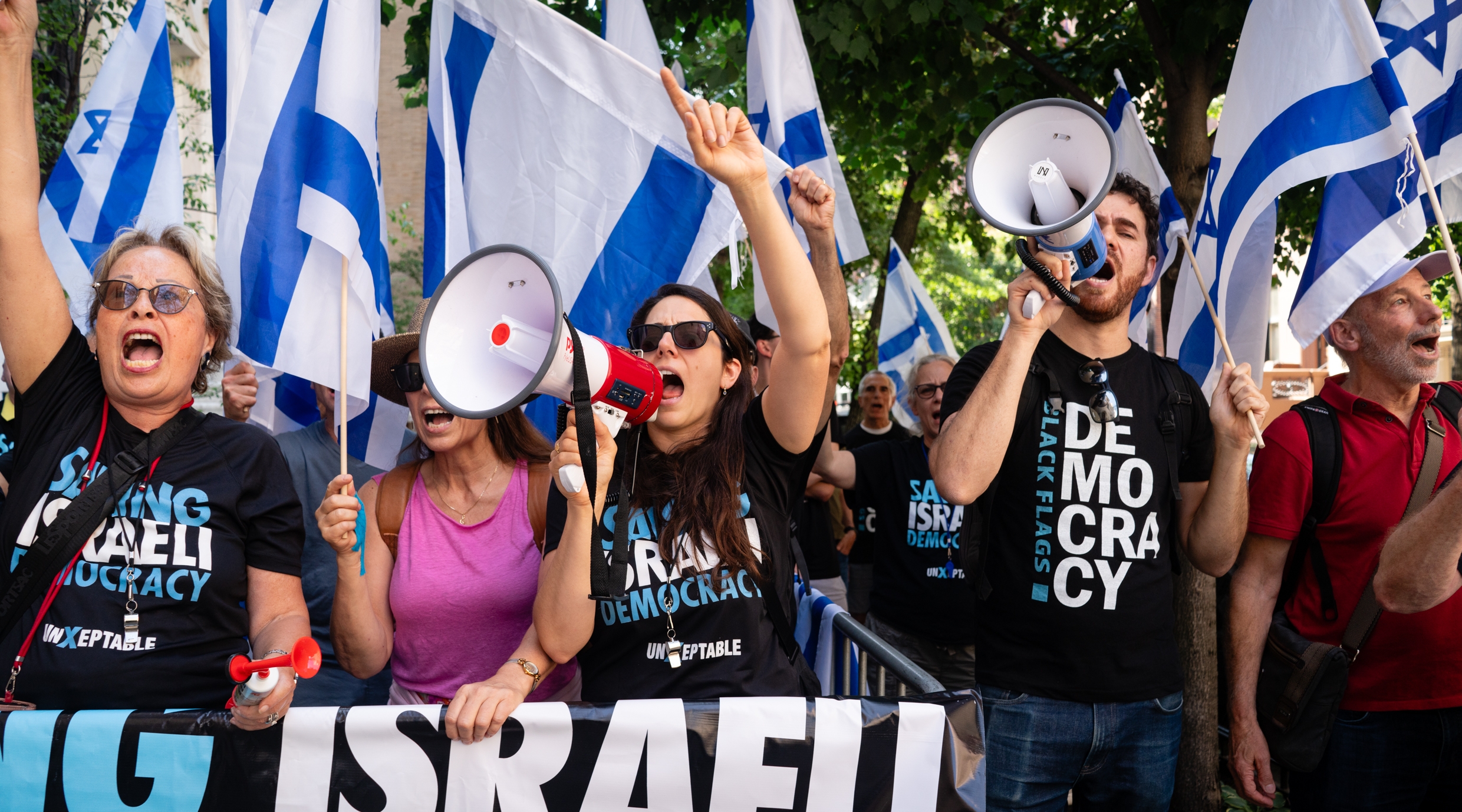 Shany Granot-Lubaton leads an anti-Netanyahu protest in Manhattan, June 2, 2023. (Luke Tress)