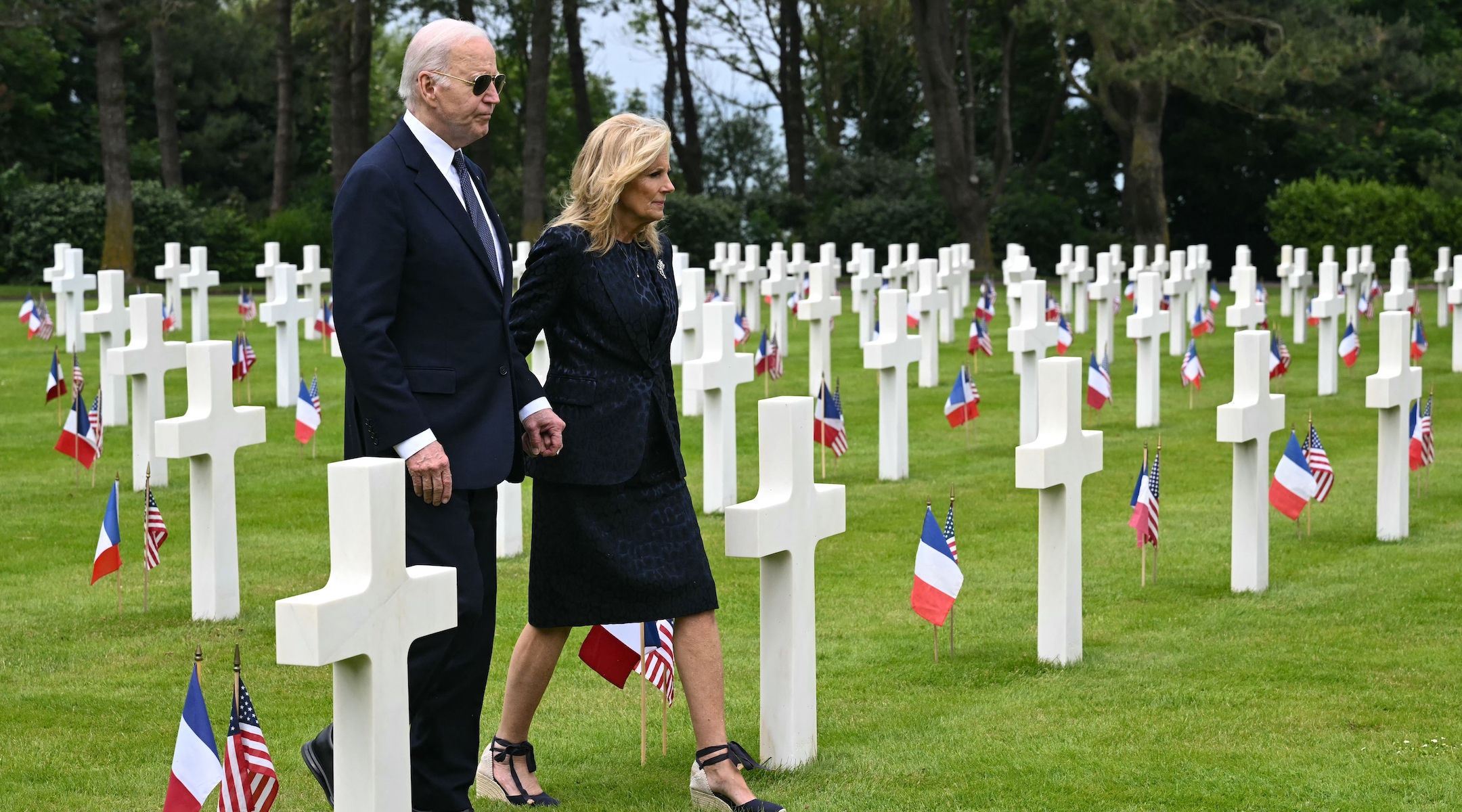 Joe and Jill Biden walk through the Normandy American cemetery