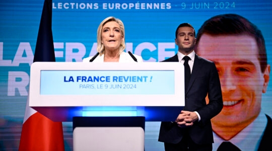 French far-right National Rally party leader Marine Le Pen (left) speaks as party President Jordan Bardella stands to her side in Paris, on June 9, 2024. (Julien De Rosa / AFP)