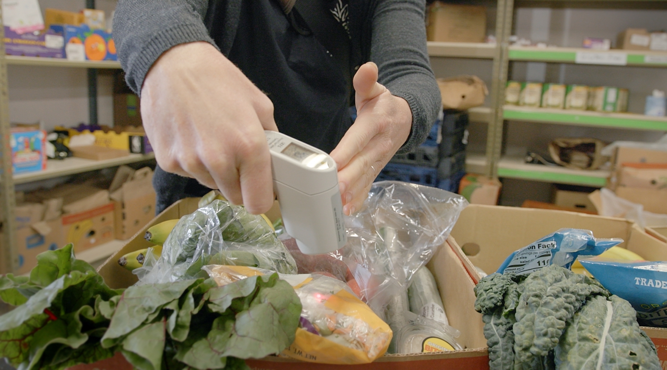 Hands inspecting produce