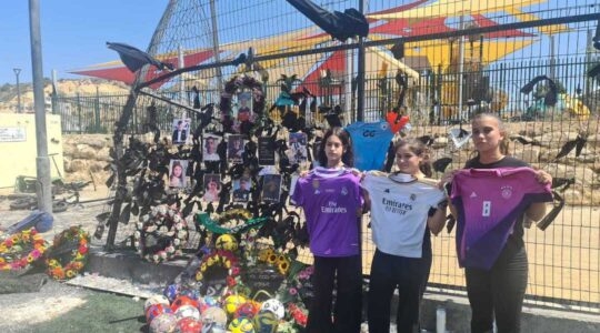 Noor ibrahim, Rena Ibrahim and Tulei Abu Jabal (left to right), cousins of one of the victims, at a memorial to those killed in the attack. (Deborah Danan)