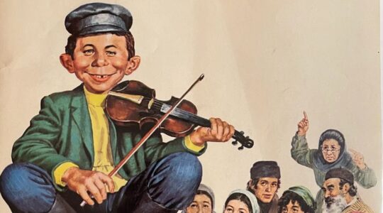 "What, Me Worry? The Art and Humor of MAD Magazine," an exhibit at the Norman Rockwell Museum, features Norman Mingo's 1973 cover illustration for MAD Magazine #156 depicting Alfred E. Newman as a character in "Fiddler on the Roof." (JTA Photo)