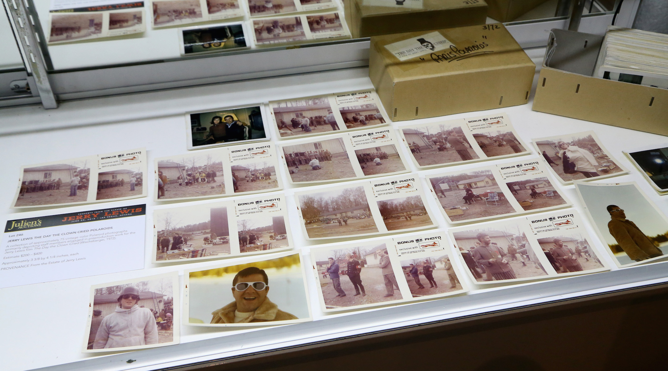 Vintage movie stills laid out during an auction