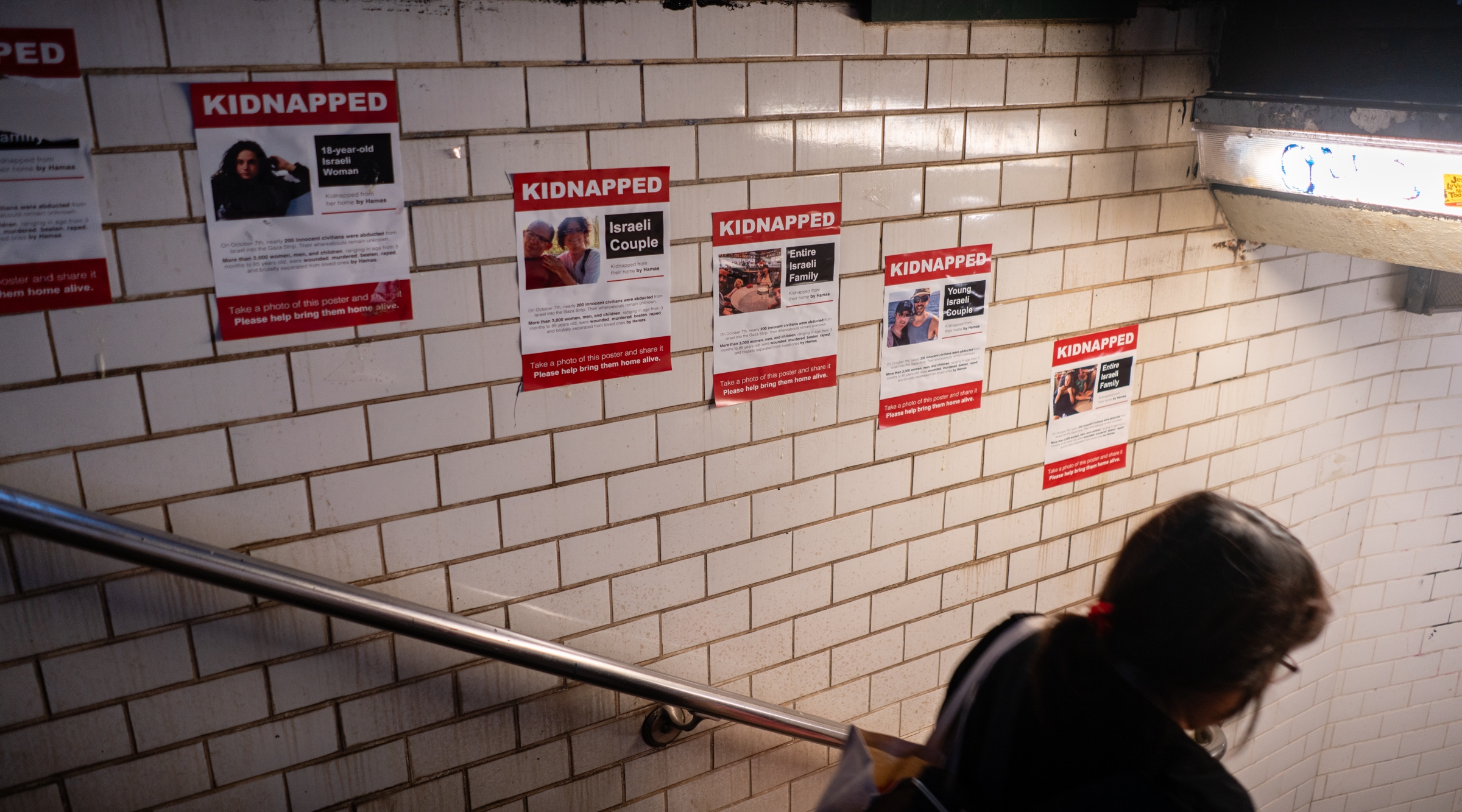 A grassroots initiative to raise awareness of the hostages' plight took off the week after the attack. Pro-Israel activists plastered city streets with posters of the captives; many were immediately torn down, Oct. 17, 2023. (Luke Tress)