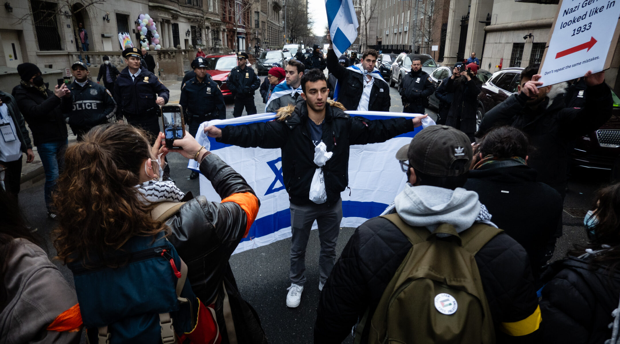 Tensions spiked at colleges, especially Columbia University, as anti-Israel groups increasingly targeted Jewish students. After a rally on campus, anti-Israel activists blocked Jewish students from walking down a street next to campus, Feb. 2, 2024. (Luke Tress)