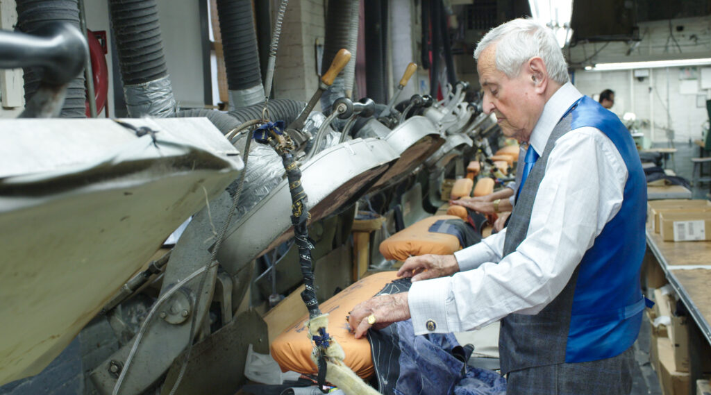 Tailor Martin Greenfield presses a jacket.