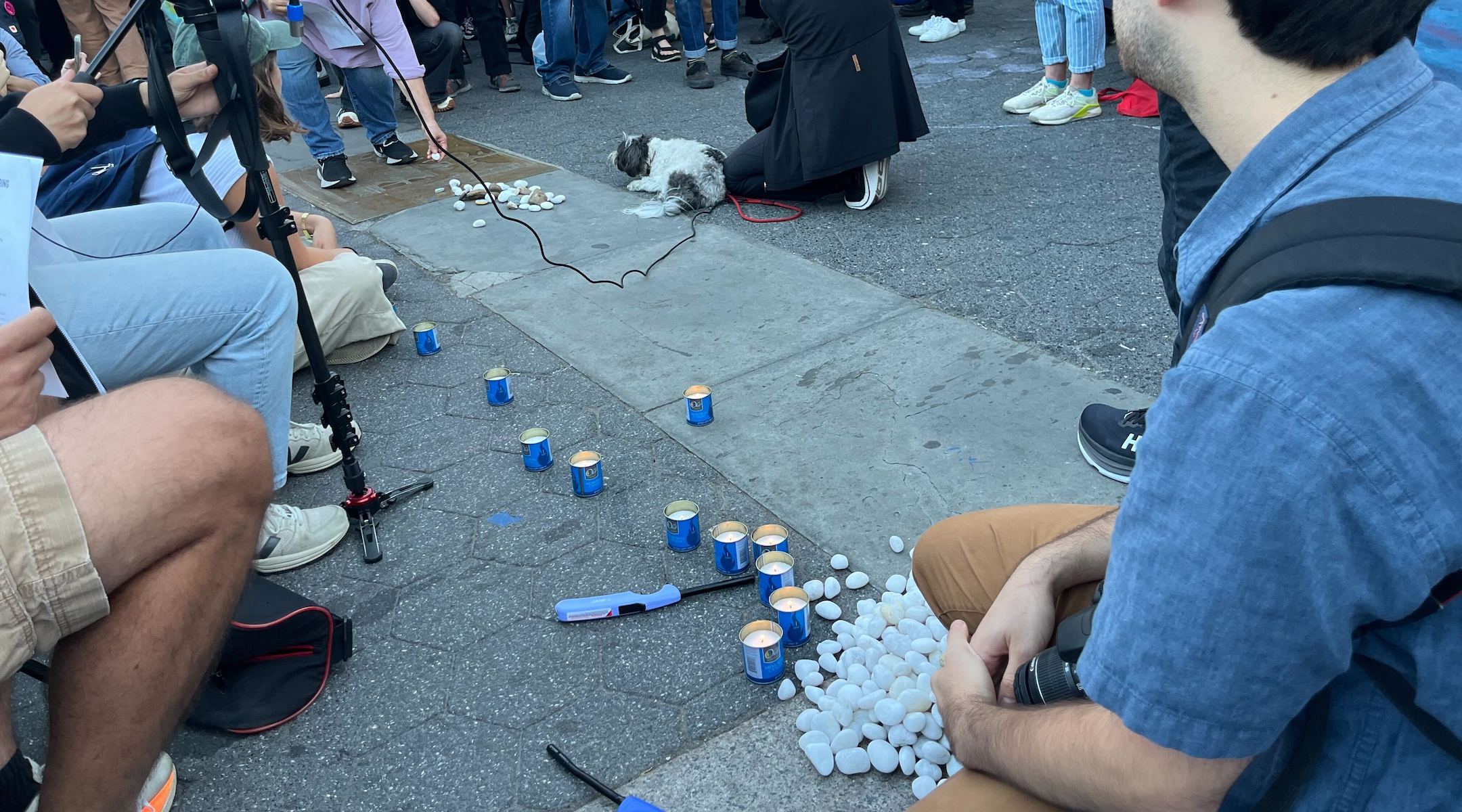 Attendees at a left-wing Jewish rally in Union Square lit yahrzeit candles and laid stones on Oct. 7, 2024 in memory of those killed over the prior year. (Julia Gergely)