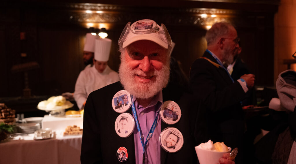 One man's jacket was lined with buttons featuring photos of J.D. Vance, other Trump allies and the president-elect himself.