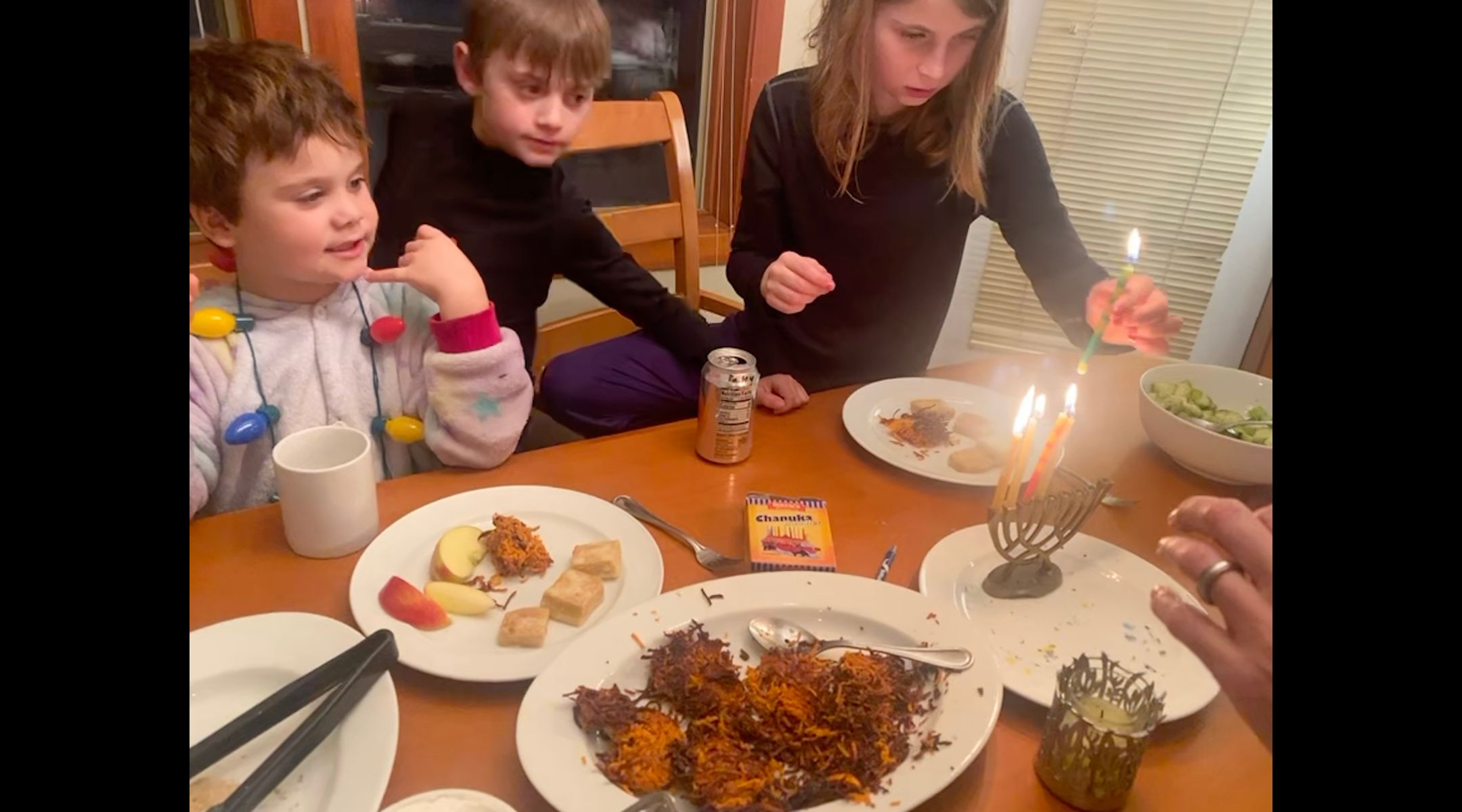 Children eating latkes