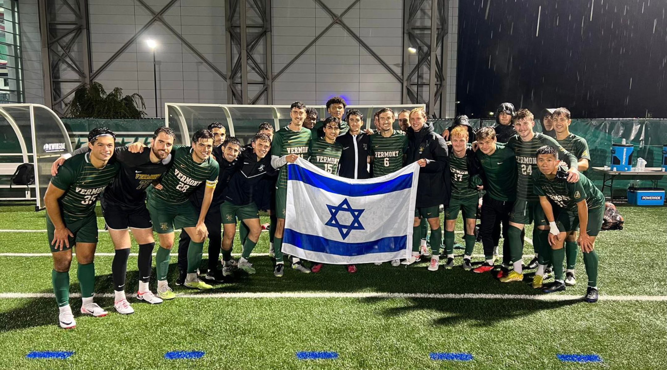 Team photo with Israeli flag