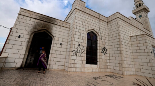 Palestinians inspect the damage done to a mosque after a reported attack by Israeli settlers in the West Bank town of Marda on Dec. 20, 2024. (Jaafar ASHTIYEH / AFP)